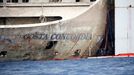 The sign of cruise liner Costa Concordia is seen during the refloat operation at Giglio harbour at Giglio Island July 21, 2014.