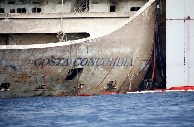 The sign of cruise liner Costa Concordia is seen during the refloat operation at Giglio harbour at Giglio Island July 21, 2014.