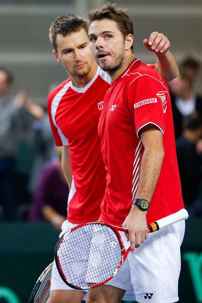 Marco Chiudinelli se Stanislasem Wawrinkou v nejdelším utkání Davis Cupu proti Čechům Tomáši Berdychovi s Lukášem Rosolem (Ženeva, 2013).