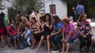 Women gather as they celebrate the future engagement of resident Saray Gabarri outside her house in Madrid's Spanish gypsy settlement of Puerta de Hierro July 31, 2012. Fifty-four families have been living in Puerta de Hierro, on the banks of the Manzanares river for over 50 years. Since the summer of 2010, the community has been subject to evictions on the grounds that the dwellings are illegal. Families whose houses have been demolished, move in with relatives whose houses still remain while the debris keeps piling up around them as more demolitions take place. Picture taken July 31, 2012. REUTERS/Susana Vera (SPAIN - Tags: SOCIETY) ATTENTION EDITORS - PICTURE 19 OF 31 FOR PACKAGE 'GYPSY SITE DEMOLISHED' SEARCH 'GYPSY SITE' FOR ALL IMAGES Published: Lis. 5, 2012, 4:12 odp.