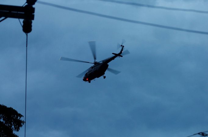 A military helicopter believed to be carrying rescued schoolboys takes off near Tham Luang cave complex in the northern province of Chiang Rai