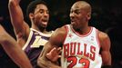 FILE PHOTO: Chicago Bulls Michael Jordan, (R) playing for the Eastern Conference, moves past Los Angeles Lakers Kobe Bryant of the Western Division, in the second half of