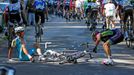 Astana team rider Michele Scarponi of Italy and Lampre-Merida team rider Jose Rodolfo Serpa of Colombia recover after crashing during the 187.5-km 11th stage of the Tour