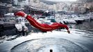 Formula One F1 - Monaco Grand Prix - Circuit de Monaco, Monaco - May 26, 2024 Ferrari's Charles Leclerc jumps into the marina after winning the Monaco Grand Prix REUTERS/