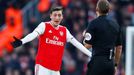 Soccer Football - Premier League - Arsenal v Chelsea - Emirates Stadium, London, Britain - December 29, 2019 Arsenal's Mesut Ozil reacts as referee Craig Pawson looks on