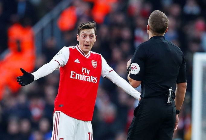 Soccer Football - Premier League - Arsenal v Chelsea - Emirates Stadium, London, Britain - December 29, 2019 Arsenal's Mesut Ozil reacts as referee Craig Pawson looks on