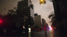 People take photos on a darkened flooded street during a blackout in Chelsea believed to be caused by rising river waters as Hurricane Sandy made its approach in New York October 29, 2012. Sandy, one of the biggest storms ever to hit the United States, roared ashore with fierce winds and heavy rain near Atlantic City, New Jersey after forcing evacuations, shutting down transportation and interrupting the presidential campaign.REUTERS/Andrew Kelly (UNITED STATES - Tags: ENVIRONMENT DISASTER) Published: Říj. 30, 2012, 3:02 dop.