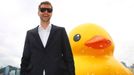 A six-storey inflatable 'rubber duck' created by Dutch artist, Florentijn Hofman, floats into Victoria harbour in Hong Kong on Thursday May 2, 2013. Towering in front of delighted crowds, the duck measures 16.5 metres high and 19.2 metres long, and takes 30 minutes to inflate. Hofman says the duck represents the union of people, adding: we're one family and all the waters in the world is our global bathtub. (EyePress/Alan Siu)