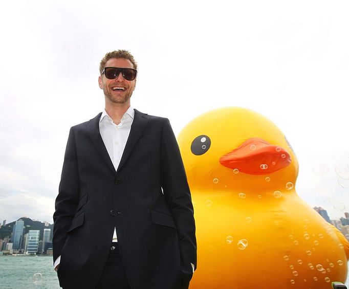 A six-storey inflatable 'rubber duck' created by Dutch artist, Florentijn Hofman, floats into Victoria harbour in Hong Kong on Thursday May 2, 2013. Towering in front of delighted crowds, the duck measures 16.5 metres high and 19.2 metres long, and takes 30 minutes to inflate. Hofman says the duck represents the union of people, adding: we're one family and all the waters in the world is our global bathtub. (EyePress/Alan Siu)