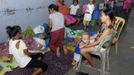 Residents take temporary shelter at an evacuation center as local officials ordered enforced evacuation ahead of Typhoon Bopha in Cagayan de Oro City, southern Philippines December 3, 2012. Philippine President Benigno Aquino told people on Monday to take storm warnings seriously as authorities evacuated thousands of residents of coastal and mountain regions hours before the biggest typhoon this year was due to hit. REUTERS/Stringer (PHILIPPINES - Tags: POLITICS ENVIRONMENT SOCIETY DISASTER) Published: Pro. 3, 2012, 12:26 odp.