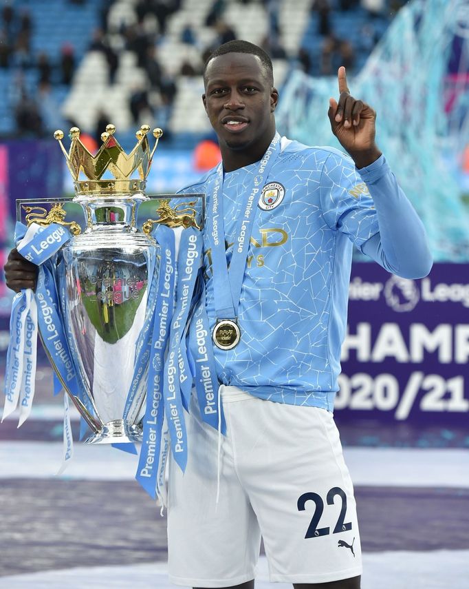 Soccer Football - Premier League - Manchester City v Everton - Etihad Stadium, Manchester, Britain - May 23, 2021 Manchester City's Benjamin Mendy poses with the trophy a