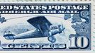 Deseticentová známka americké letecké pošty na počest kapitána Charlese Lindbergha a letadla Spirit of St Louis. Vydána 11. června 1927.