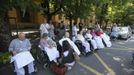 People wait outside a hospital after an earthquake in Crevalcore near Modena