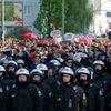 German police officers secure people walking during a May Day march through Berlin's Kreuzberg district