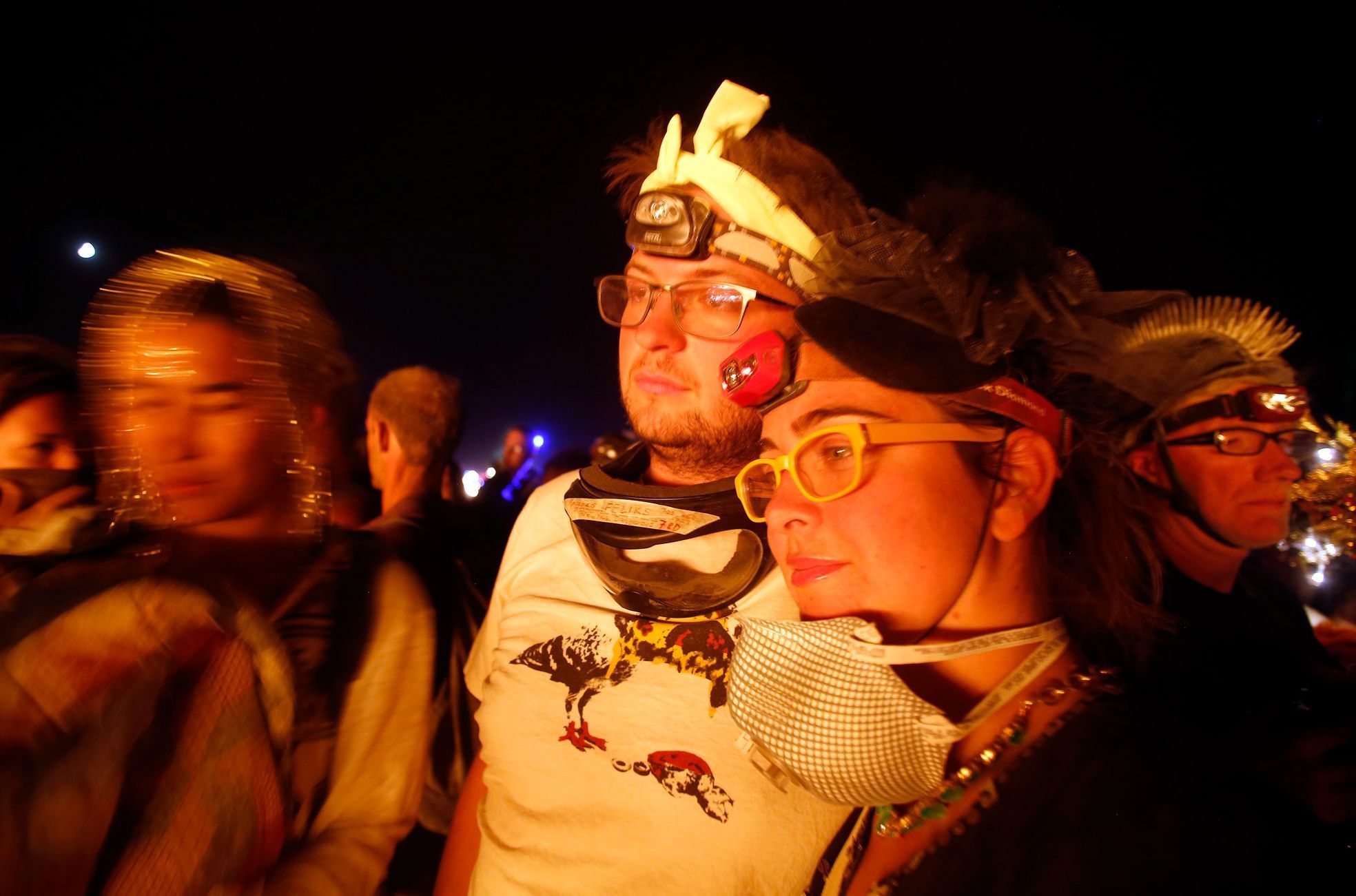 Zev Stone, left, and Nina Tasp watch as the Temple of Grace burns on the last day of the Burning Man 2014 &quot;Caravansary&quot; arts and music festival in the Black Rock Desert of Nevada