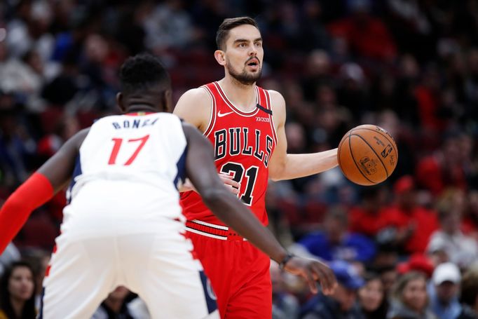 Feb 23, 2020; Chicago, Illinois, USA; Chicago Bulls guard Tomas Satoransky (31) brings the ball up court against Washington Wizards forward Isaac Bonga (17) during the fi