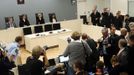 Norwegian mass killer Anders Behring Breivik (R) gestures as he arrives at the court room in Oslo Courthouse August 24, 2012. The Norwegian court found Breivik sane on Friday in the murder of 77 people in a gun and bomb massacre last year, sending him to jail for at least 21 years and dismissing the prosecution's request for an insane verdict. REUTERS/Cornelius Poppe/NTB Scanpix/Pool (NORWAY - Tags: CRIME LAW) Published: Srp. 24, 2012, 8:24 dop.