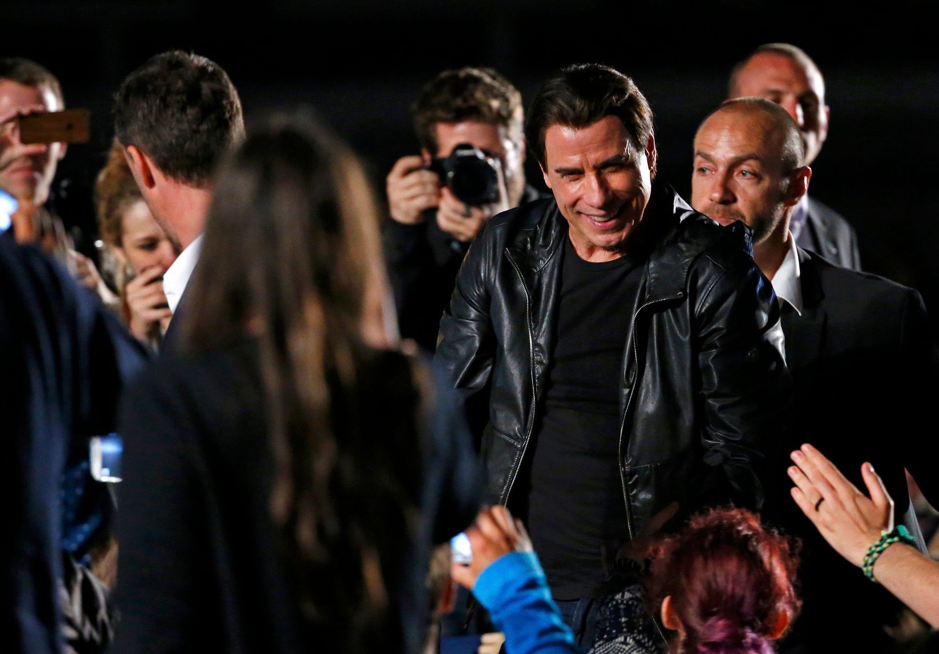 Actor John Travolta arrives to attend a beach front cinema screening for the film &quot;Pulp Fiction&quot; during the 67th Cannes Film Festival in Cannes