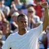 Lleyton Hewitt of Australia gestures to the crowd after losing his match against Jarkko Nieminen of Finland at the Wimbledon Tennis Championships in London