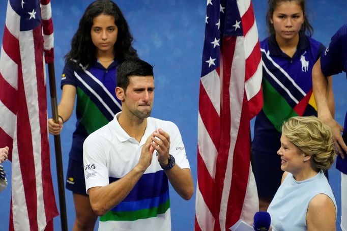 Sep 12, 2021; Flushing, NY, USA; Novak Djokovic of Serbia  (L) is overcome with emotion during an interview with ESPN hist Chris McKendry (R) during the trophy ceremony a