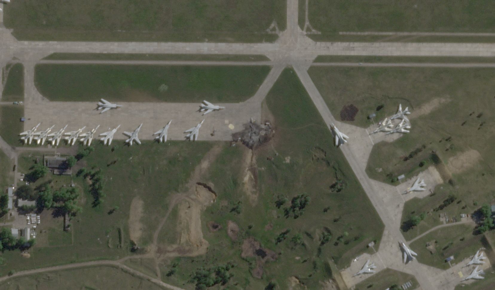 FILE PHOTO: Satellite view shows damaged planes and tarmac at Russian Belaya airfield
