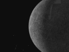 Merkur, jak ho viděl Messenger ještě před pondělním přiblížením.
