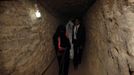 Palestinian groom Emad al-Malalha, 21, walks with Manal Abu Shanar, 17, his Egyptian bride inside a smuggling tunnel beneath the Gaza-Egypt border in the southern Gaza Strip March 21, 2013. Al-Malalha , who said that his bride was not given a permit from Egyptian authorities to enter the Gaza Strip, brought her from neighboring Egypt through a smuggling tunnel to celebrate his wedding in his native Gaza Strip. REUTERS/Ibraheem Abu Mustafa (GAZA - Tags: POLITICS SOCIETY) Published: Bře. 21, 2013, 6:22 odp.