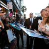 Cast member Johansson signs autographs at the premiere of &quot;Captain America: The Winter Soldier&quot; at El Capitan theatre in Hollywood