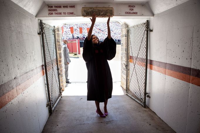 May 11, 2012 "Lawrence Jackson made this great photograph of the First Lady touching the Hokie Stone before walking onto the field at Lane Stadium to give the Virginia Tech commencement address in Blacksburg, Va."