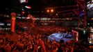 Delegates are bathed in red light as they wave flags and dance to the music as singer and songwriter Ledisi performs during the first session of the Democratic National Convention in Charlotte, North Carolina, September 4, 2012. REUTERS/Chris Keane (UNITED STATES - Tags: POLITICS ELECTIONS ENTERTAINMENT) Published: Zář. 5, 2012, 12:13 dop.