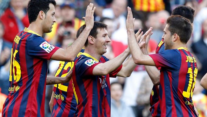 Barcelona's Lionel Messi celebrates a goal with his teammates against Osasuna during their Spanish first division soccer match at Camp Nou stadium in Barcelona