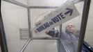 A municipal worker of Lille prepares ballot boxes for the upcoming French presidential election in Lille