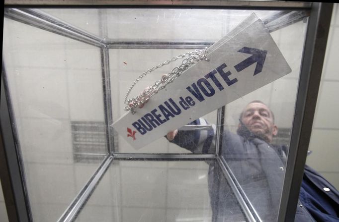 A municipal worker of Lille prepares ballot boxes for the upcoming French presidential election in Lille