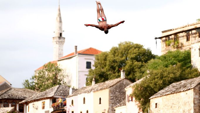 A man jumps from the Old Bridge during the 453rd traditional diving competition in Mostar, Bosnia and Herzegovina, July 28, 2019. REUTERS/Dado Ruvic