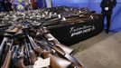 Tables covered with guns area seen Tuesday, Jan. 29, 2013, in Trenton, N.J., during a display of 2,600 guns, including 700 that were illegal, that were turned in last Friday and Saturday during a gun buyback program in the state's capital. (AP Photo/Mel Evans)