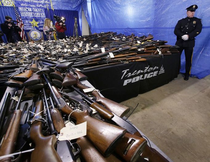 Tables covered with guns area seen Tuesday, Jan. 29, 2013, in Trenton, N.J., during a display of 2,600 guns, including 700 that were illegal, that were turned in last Friday and Saturday during a gun buyback program in the state's capital. (AP Photo/Mel Evans)