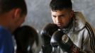 Unemployed Belgian Mohamed Sammar takes part in a "Fit for a job" boxing class in Brussels June 14, 2013. Sammar, 27, has been looking for a job in the construction sector for 2 years. "Fit for a job" is the initiative of former Belgian boxing champion Bea Diallo, whose goal was to restore the confidence of unemployed people and help them find a job through their participation in sports. Picture taken June 14, 2013. REUTERS/Francois Lenoir (BELGIUM - Tags: SPORT BOXING SOCIETY BUSINESS EMPLOYMENT) Published: Čec. 5, 2013, 3:54 odp.