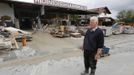 Wood mercantilist Walter Hundshammer, 73, looks at the remnants of his wood firm founded in 1909 by his grandfather in Natternberg, a suburb of the eastern Bavarian city of Deggendorf June 10, 2013. Hundshammer said to Reuters on Monday that he is estimating the damage over one million Euros after the floods of the nearby Danube river subsided. REUTERS/Wolfgang Rattay (GERMANY - Tags: POLITICS DISASTER)