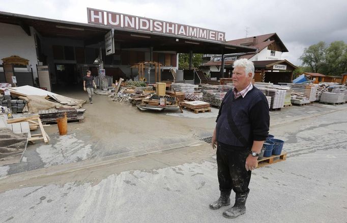 Wood mercantilist Walter Hundshammer, 73, looks at the remnants of his wood firm founded in 1909 by his grandfather in Natternberg, a suburb of the eastern Bavarian city of Deggendorf June 10, 2013. Hundshammer said to Reuters on Monday that he is estimating the damage over one million Euros after the floods of the nearby Danube river subsided. REUTERS/Wolfgang Rattay (GERMANY - Tags: POLITICS DISASTER)