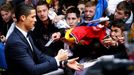 Real Madrid's Cristiano Ronaldo (L) signs autographs for fans as he arrives for the Ballon d'Or awards ceremony in Zurich January 12, 2015. REUTERS/Ruben Sprich (SWITZERL