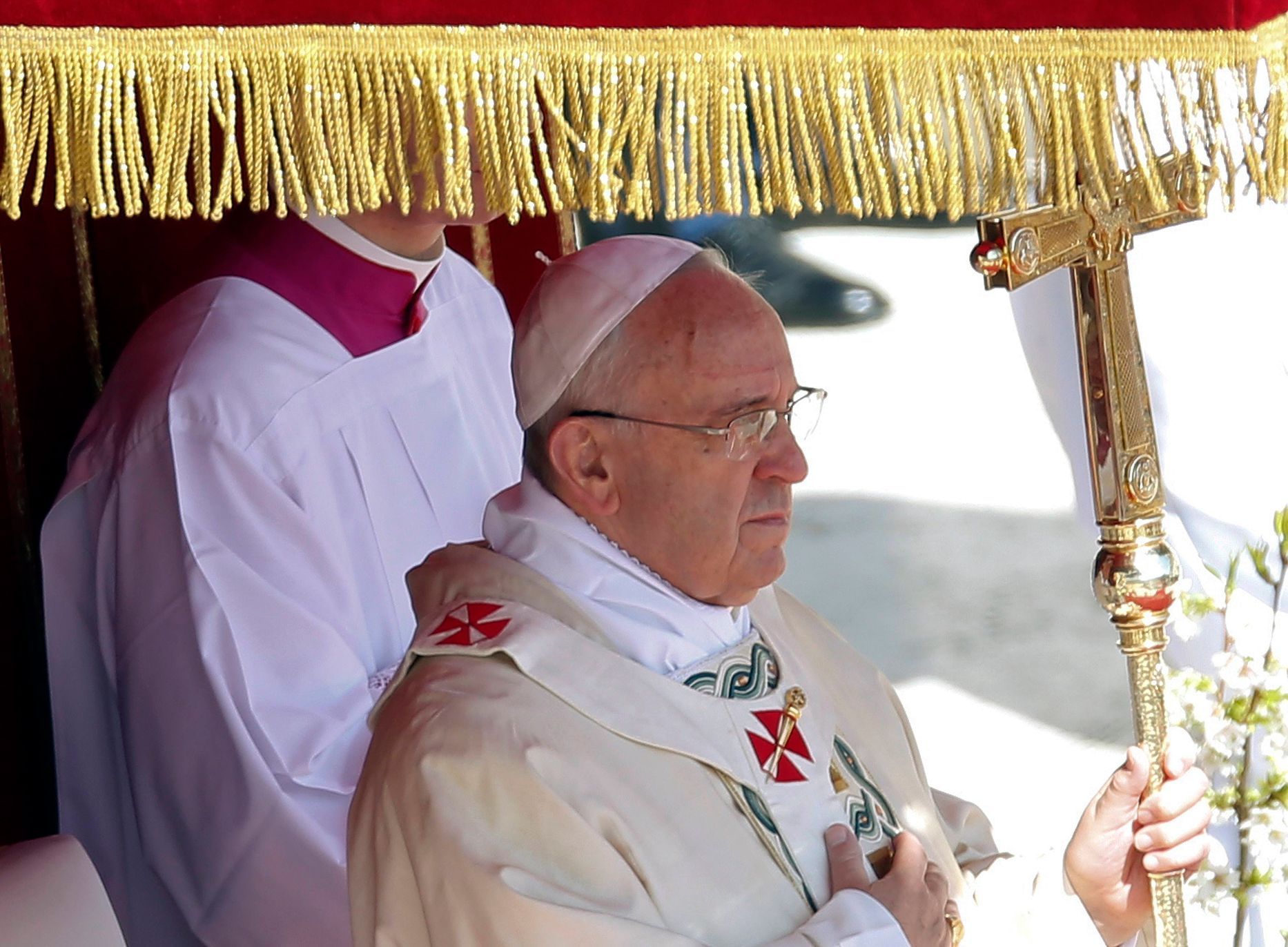 Pope Francis holds his pastoral cross as he leads the Easter mass in Saint Peter's Square at the Vatican