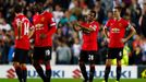 Manchester United's Anderson and Evans react after Grigg of Milton Keynes Dons scored their second goal during their League Cup soccer match at stadiummk in Milton Keynes