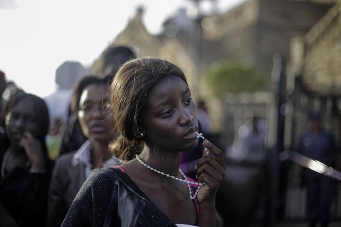 Markus Schreiber, a German photographer working for The Associated Press won the 1st Prize People - Observed Portraits Single category of the 2014 World Press Photo contest with this picture of a woman reacting in disappointment after access to see former South Africa President Nelson Mandela was closed on the third and final day of his casket lying in state, outside Union Buildings in Pretoria, South Africa, taken December 13, 2013.