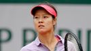 Li Na of China reacts during her women's singles match against Kristina Mladenovic of France at the French Open tennis tournament at the Roland Garros stadium in Paris Ma