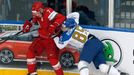 Kazakhstan's Konstantin Romanov (R) collides with Vladimir Denivov of Belarus (L) during the first period of their men's ice hockey World Championship Group B game at Min