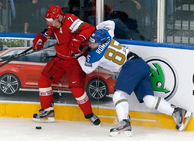 Kazakhstan's Konstantin Romanov (R) collides with Vladimir Denivov of Belarus (L) during the first period of their men's ice hockey World Championship Group B game at Min