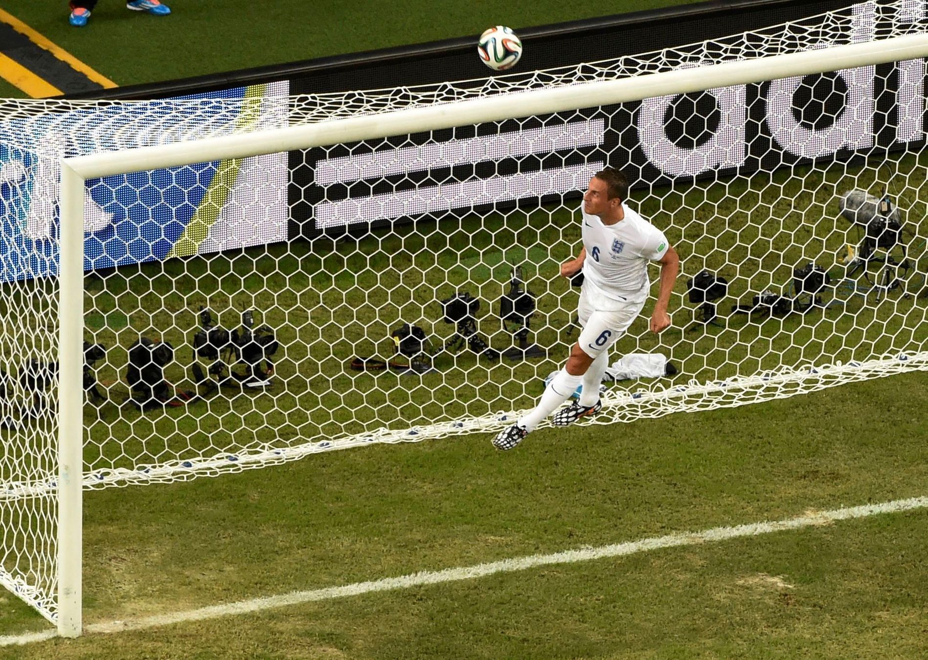 England's Jagielka saves the ball during the 2014 World Cup Group D soccer match between England and Italy at the Amazonia arena in Manaus