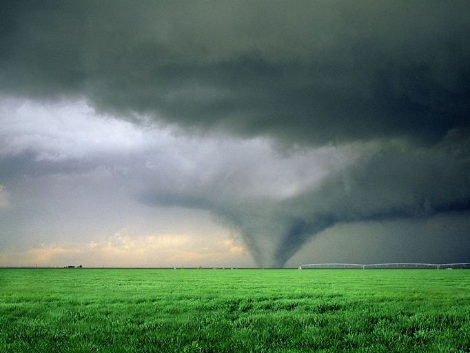 Large tornado North of Gruver Texas wide showing green wheat field and Zimmatic filed irrigation sy Large Wedge Tornado North East of Gruver Texas over green wheat field. Rated F3 on the Fujita scale this tornado caused extensive damage in Oklahoma and Kansas although no deaths reported with this storm. Showing a Zimmatic advanced irrigation control systems that utilize the most up-to-date computer technology. Keywords Willett and Tornado to see other images of this same tornado or keyword Lightningsmiths to see my other tornado and severe weather images. May 5th 1993