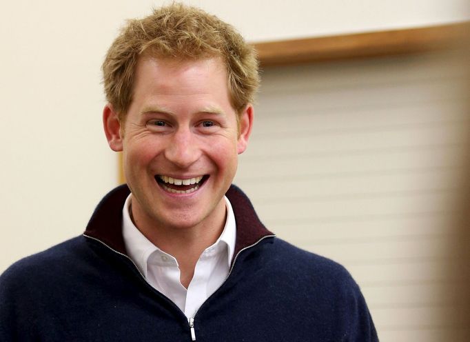 Britain's Prince Harry laughs as he meets locals at the Stewart Island community center during his visit to Stewart Island in the south of New Zealand