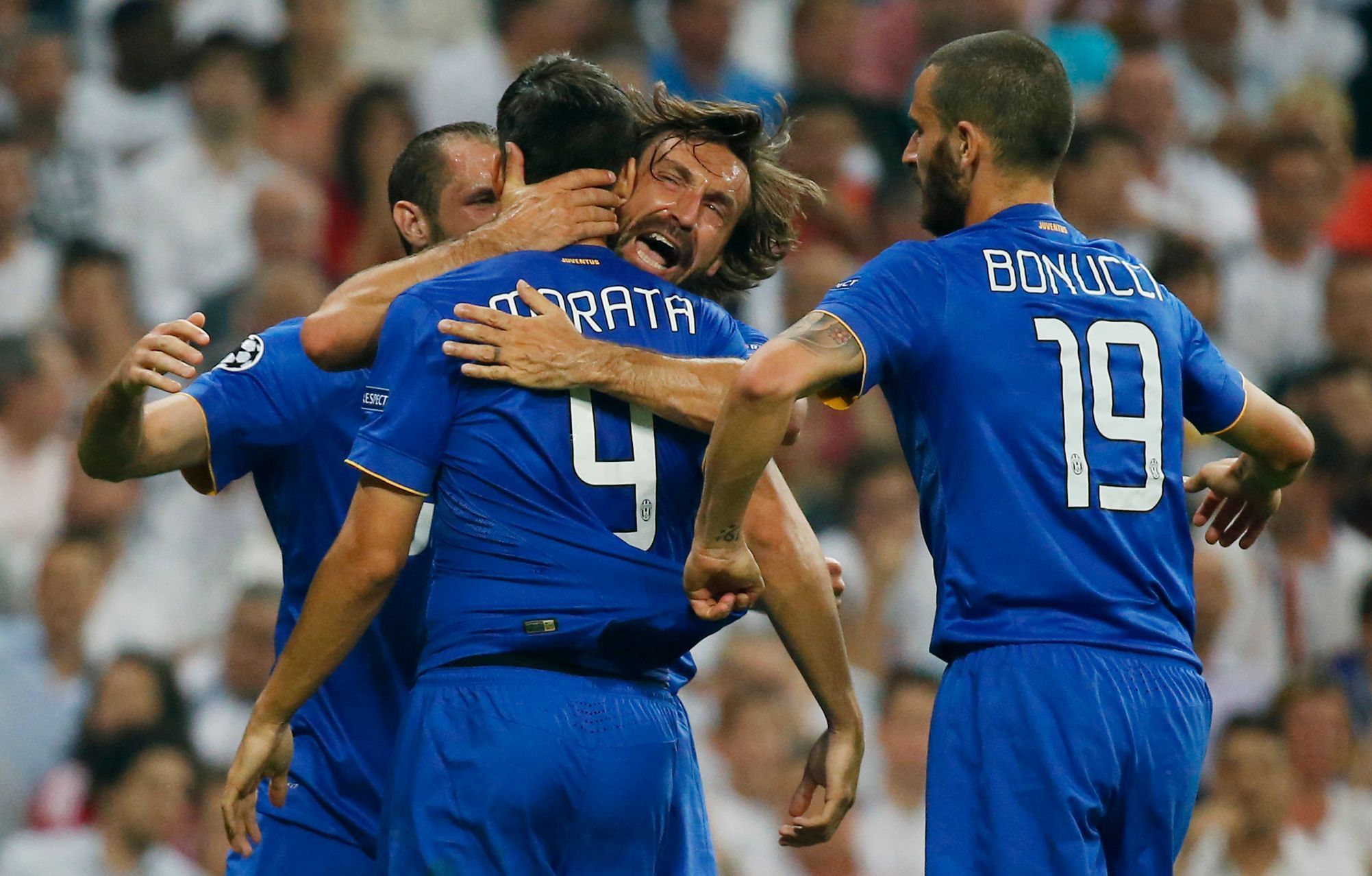 Alvaro Morata a hráči Juventusu slaví branku v semifinále LM